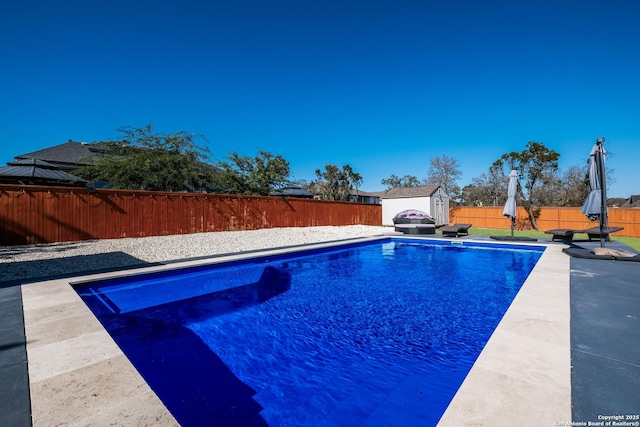 view of pool with a shed