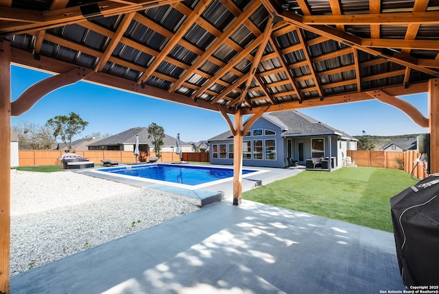 view of swimming pool featuring a patio, area for grilling, and a lawn