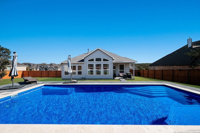 view of pool featuring a yard