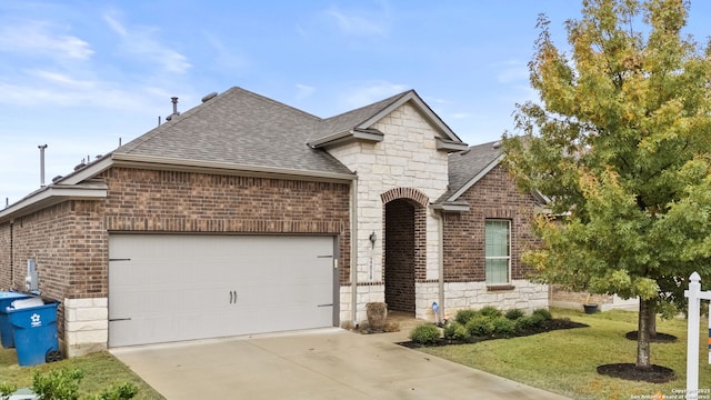 view of front facade featuring a garage and a front lawn