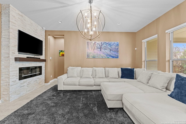 living room featuring tile patterned floors, a stone fireplace, and a notable chandelier