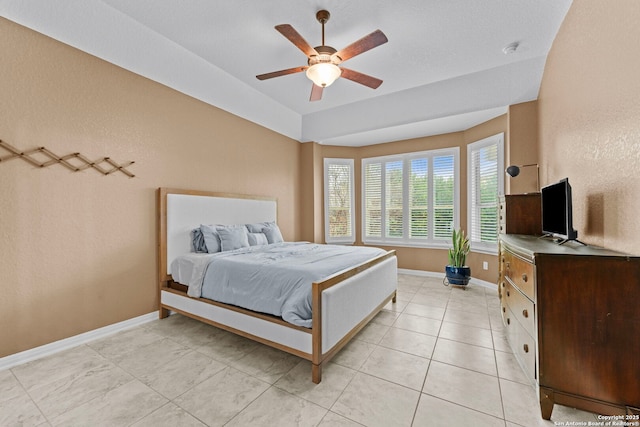 tiled bedroom with ceiling fan