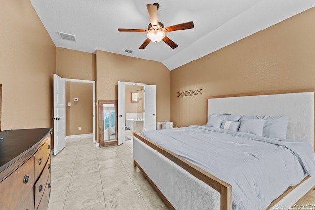 bedroom with ensuite bathroom, ceiling fan, and lofted ceiling