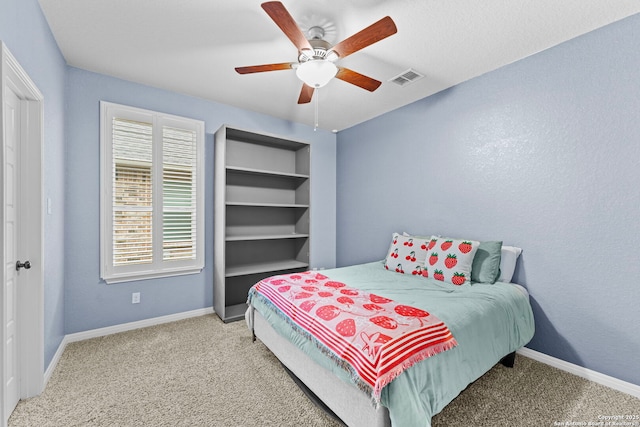 carpeted bedroom featuring ceiling fan