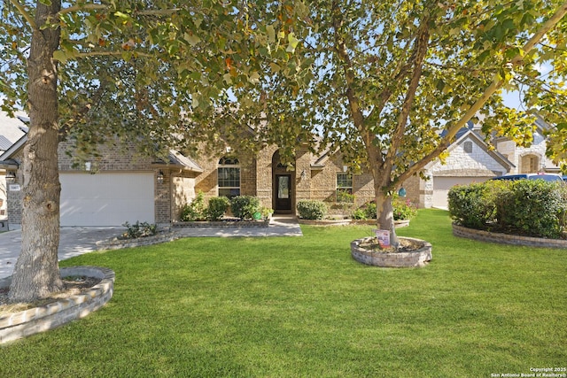 view of property hidden behind natural elements with a garage and a front lawn