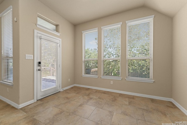 doorway featuring vaulted ceiling