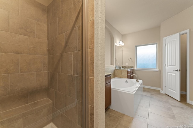 bathroom with tile patterned floors, vanity, and independent shower and bath