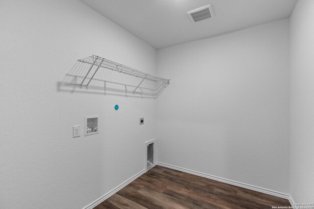 washroom featuring washer hookup, dark hardwood / wood-style floors, and hookup for an electric dryer