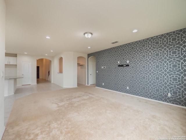 empty room featuring light colored carpet