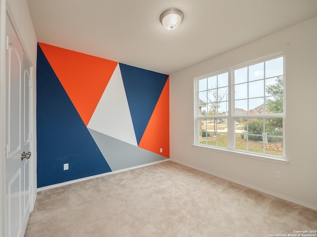 spare room with light colored carpet