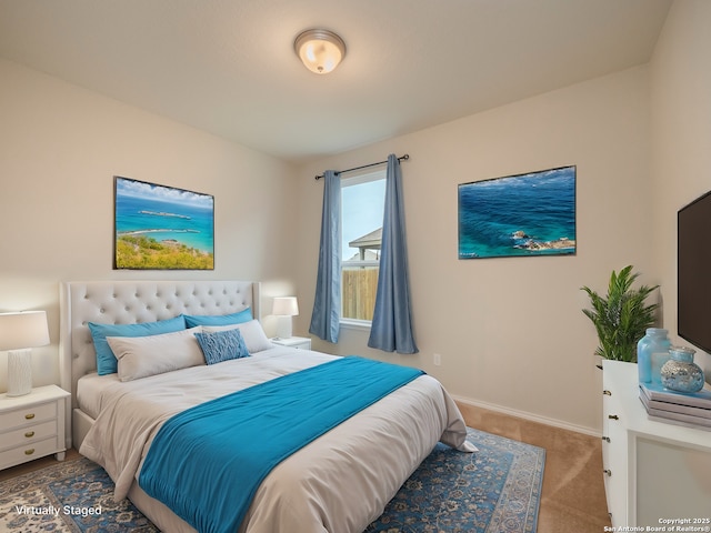 bedroom featuring light carpet