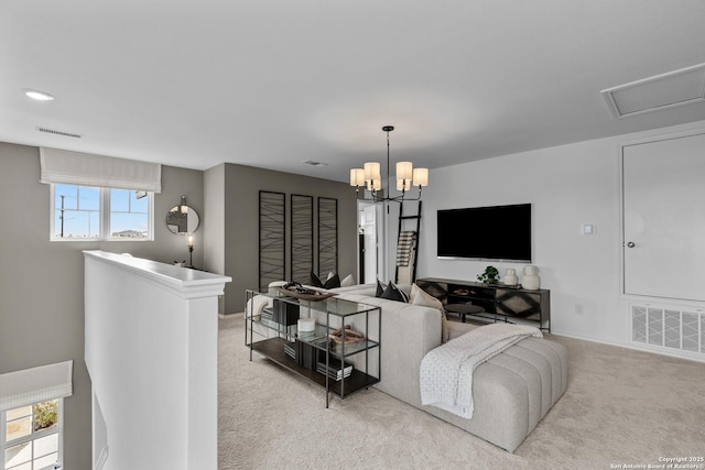 carpeted living room featuring a chandelier