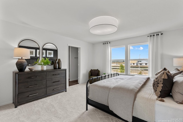 bedroom featuring light colored carpet