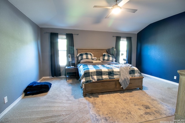 bedroom featuring ceiling fan, carpet floors, and vaulted ceiling