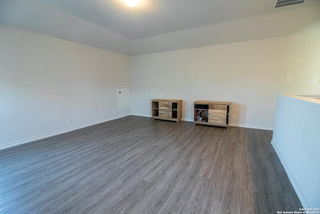 spare room featuring dark hardwood / wood-style flooring