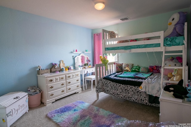 bedroom featuring light carpet