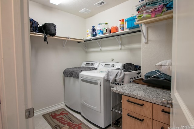 laundry room with washer and dryer