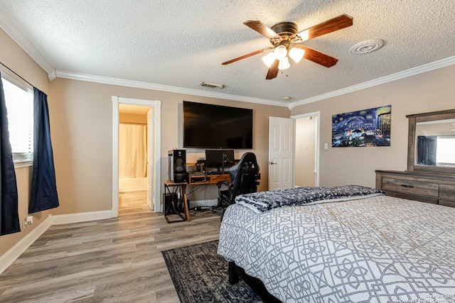 bedroom featuring hardwood / wood-style floors, a textured ceiling, ceiling fan, and ornamental molding