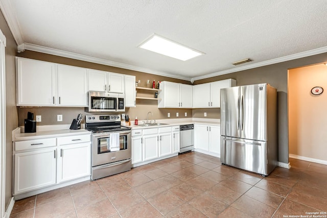 kitchen featuring white cabinets, stainless steel appliances, ornamental molding, and sink