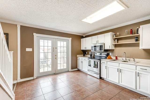 kitchen featuring white cabinetry, sink, french doors, crown molding, and appliances with stainless steel finishes