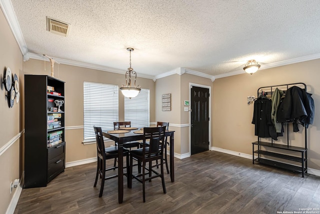 dining space with a textured ceiling, crown molding, and dark wood-type flooring