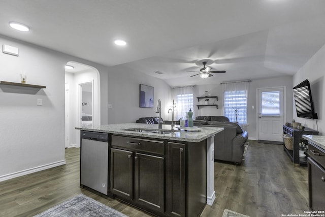 kitchen with dishwasher, dark wood-type flooring, a center island with sink, sink, and ceiling fan