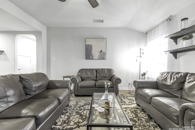 living room featuring hardwood / wood-style flooring and lofted ceiling