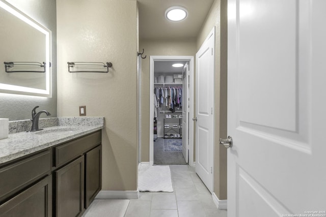 bathroom with tile patterned floors and vanity