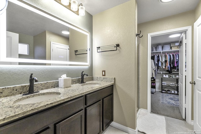 bathroom with vanity and walk in shower