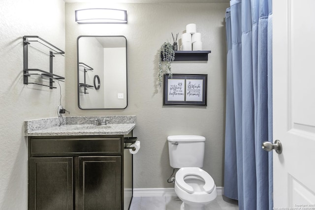 bathroom featuring tile patterned floors, walk in shower, vanity, and toilet