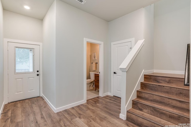 foyer entrance with light hardwood / wood-style floors