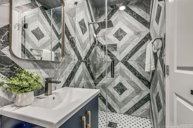 bathroom featuring vanity and a shower with shower door