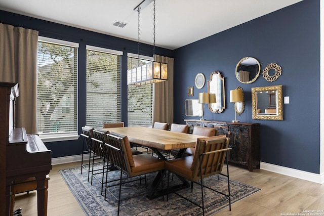 dining area featuring light wood-type flooring