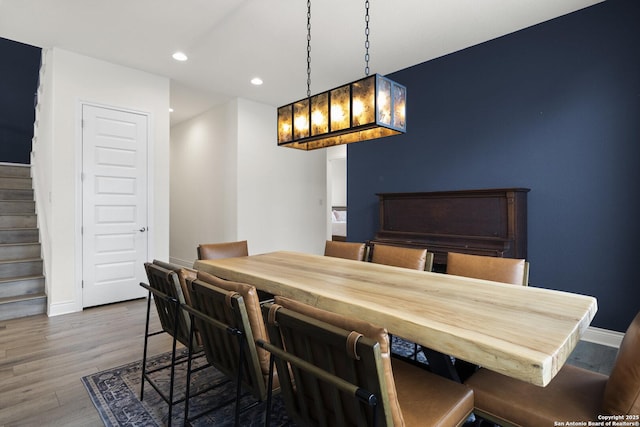 dining area with hardwood / wood-style flooring