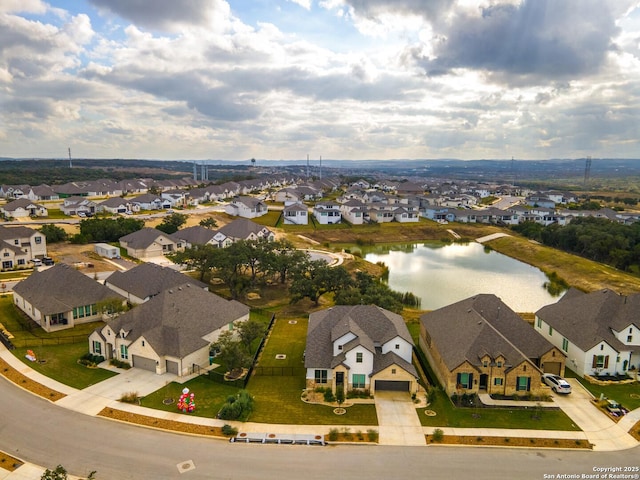 drone / aerial view featuring a water view