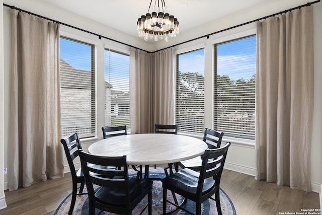 dining room with a chandelier and hardwood / wood-style flooring