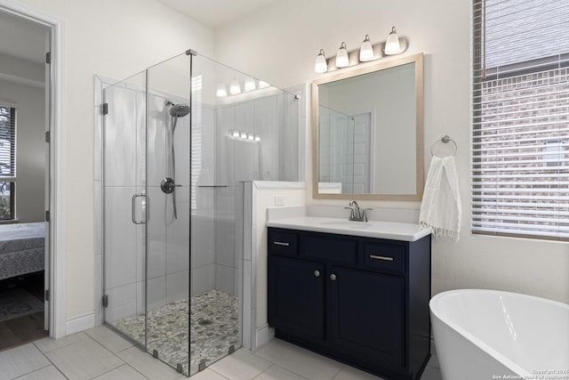 bathroom featuring tile patterned flooring, vanity, and independent shower and bath