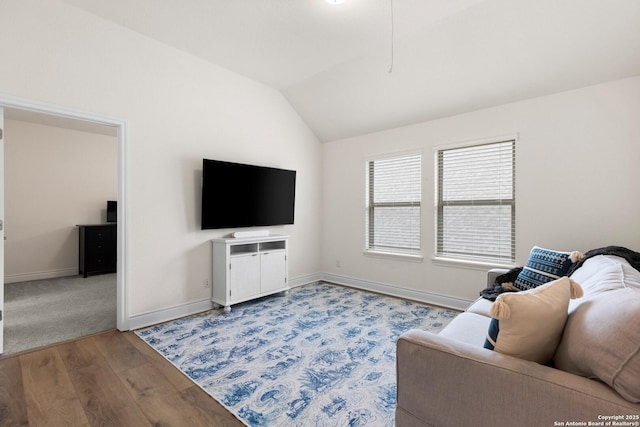 living room with wood-type flooring and lofted ceiling