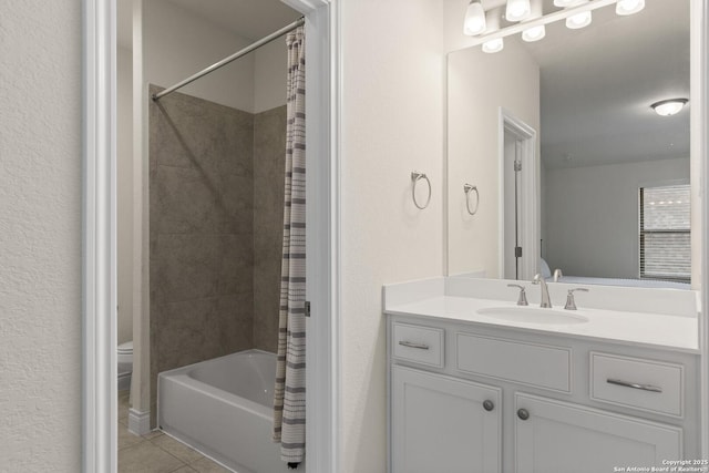 full bathroom featuring toilet, vanity, tile patterned floors, and shower / tub combo with curtain