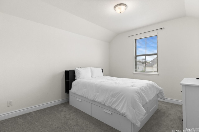 carpeted bedroom with vaulted ceiling