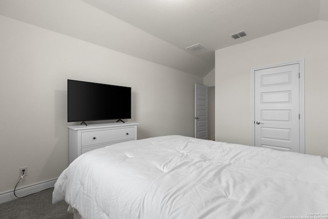 bedroom featuring lofted ceiling and carpet floors