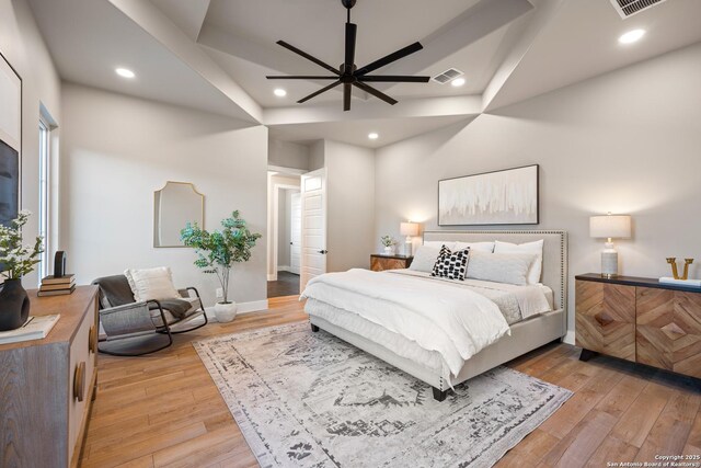 bedroom featuring light hardwood / wood-style floors and ceiling fan