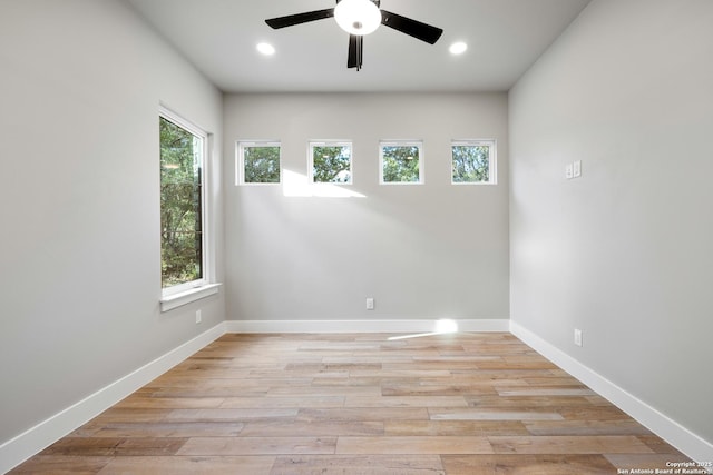 spare room with ceiling fan and light hardwood / wood-style floors