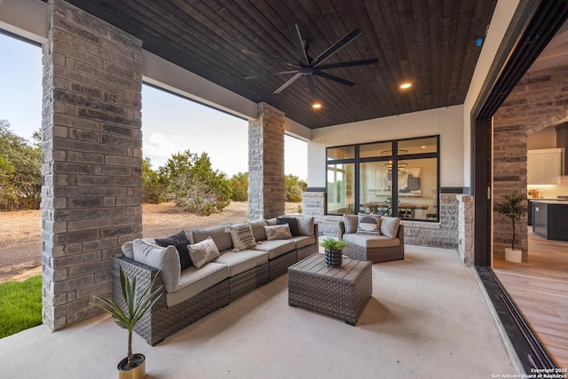 view of patio with ceiling fan and an outdoor hangout area