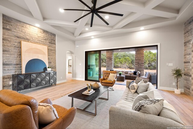 living room with light wood-type flooring and ceiling fan