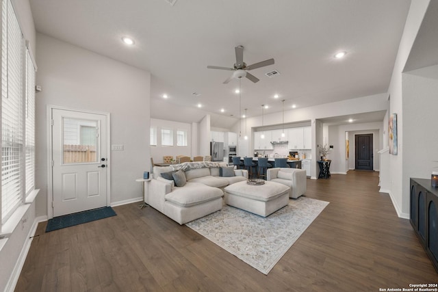 living room featuring high vaulted ceiling, ceiling fan, and dark wood-type flooring