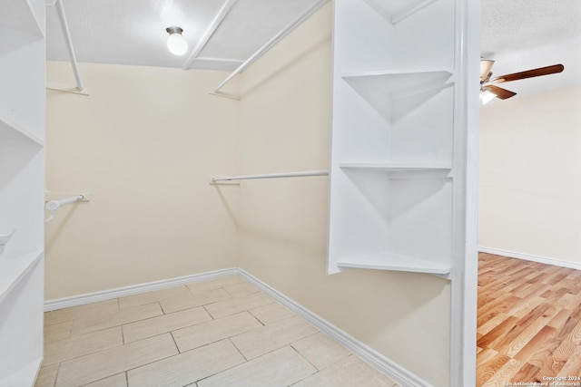 spacious closet with ceiling fan