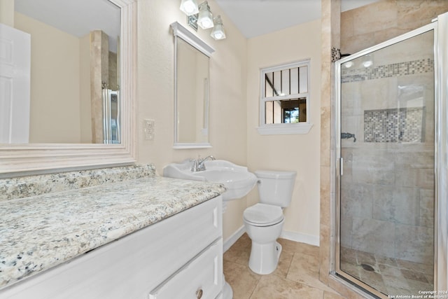 bathroom featuring walk in shower, tile patterned flooring, vanity, and toilet