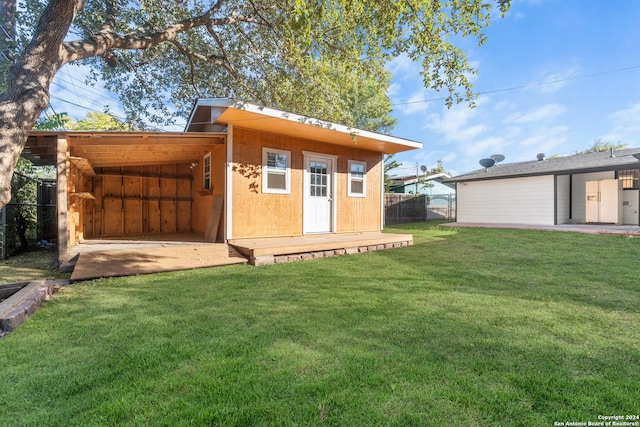 rear view of house with a yard