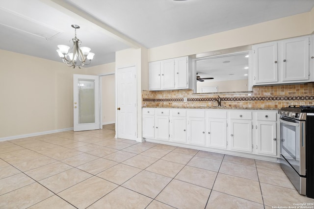 kitchen featuring white cabinetry, light tile patterned floors, light stone countertops, and stainless steel range oven